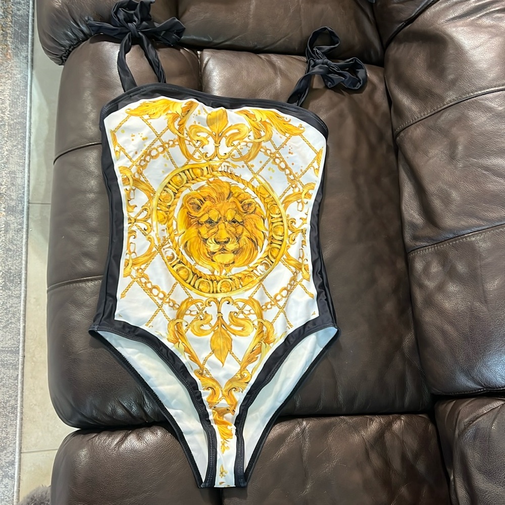 One piece swimsuit. With cover. New